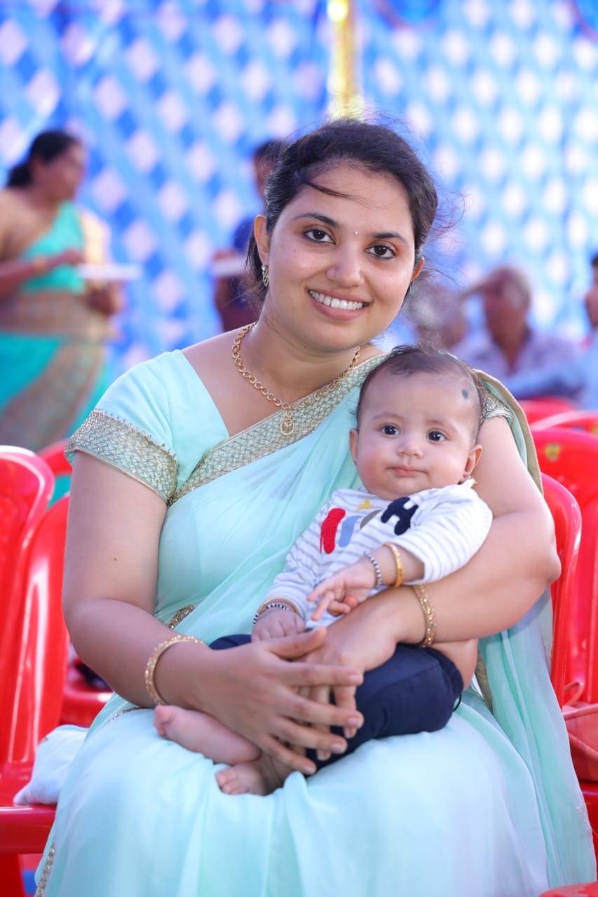 Anjaly before — in a light blue saree, heavier postpartum body